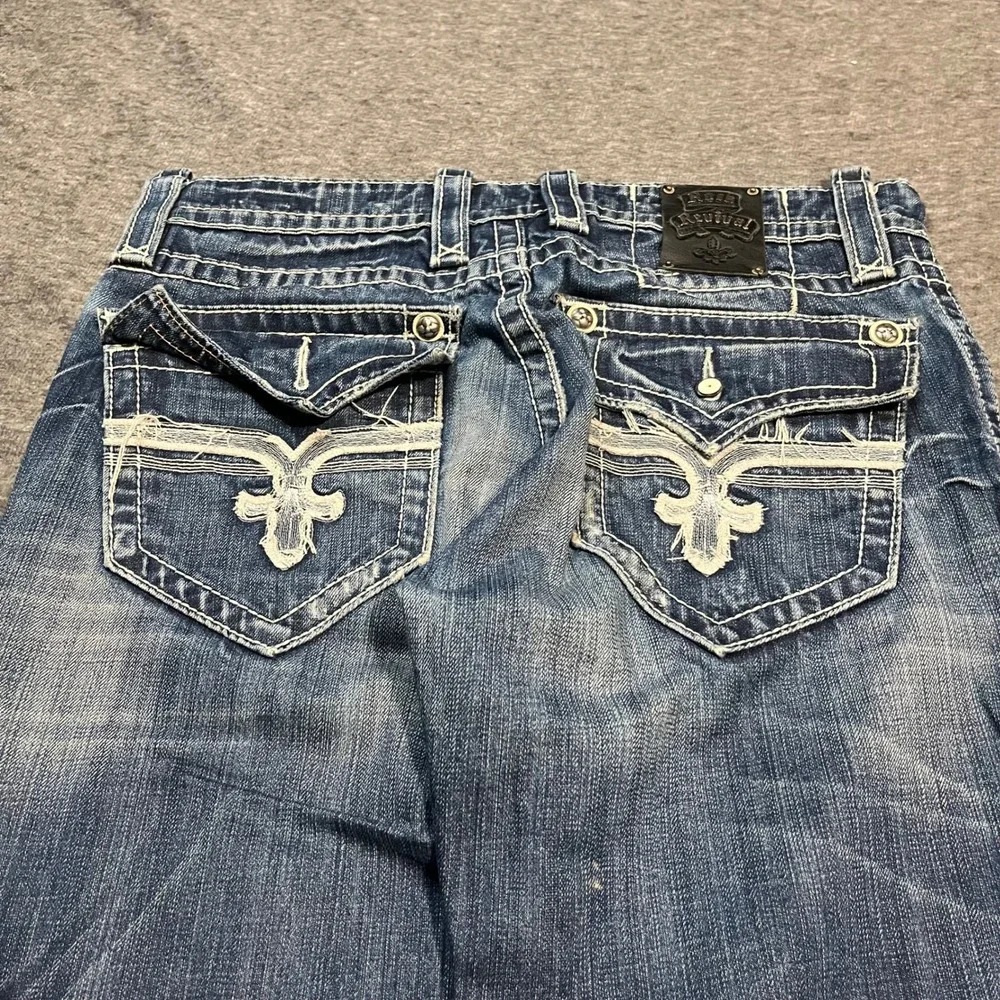 Rock Revival John Straight Distressed Blue Jeans Mens 34 Fleur De Lis Raw Hem